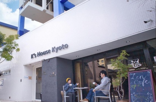 K's House Kyoto hostel common area with travellers