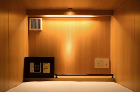 Tsukimi Hotel Kyoto capsule and bunk area with warm wooden finish