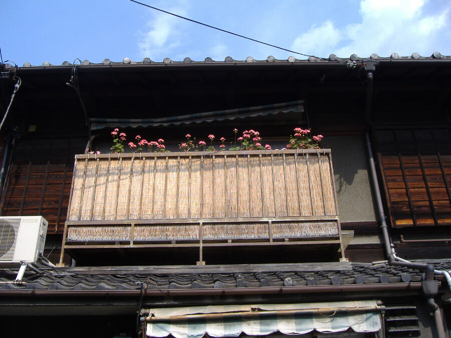Traditional Kyoto machiya townhouse with wooden facade and lattice windows