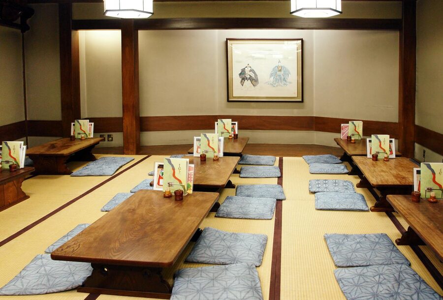 Traditional tatami-floored room in a Japanese ryokan with low table and cushions