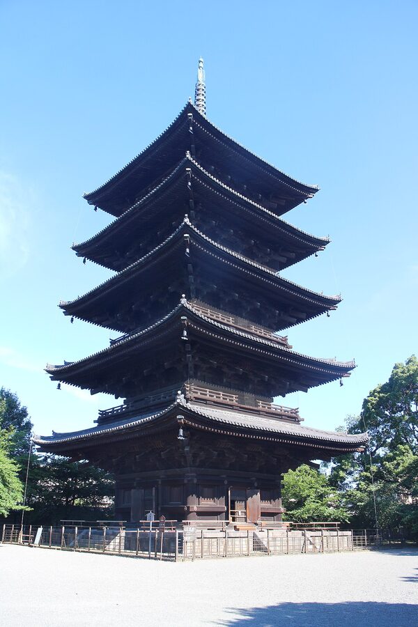 The five-storied pagoda at To-ji temple rising above surrounding trees and temple buildings